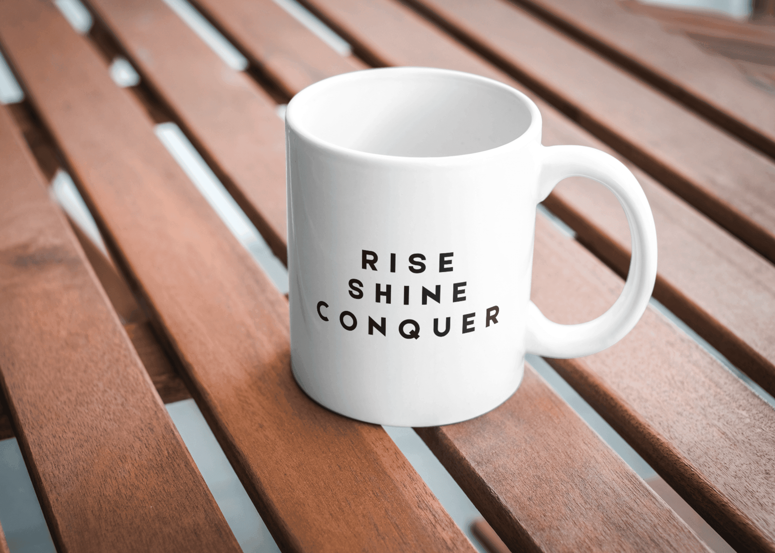 White ceramic mug with bold black text 
